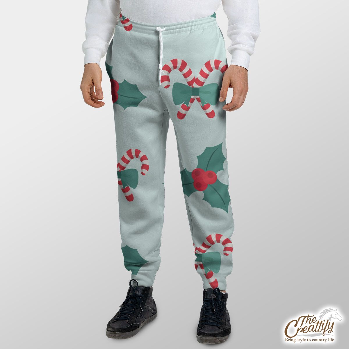 Candy Cane, Holly Leaf On Pastel Blue Background Sweatpants