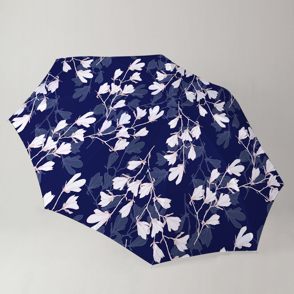 White Magnolia Flower On Dark Blue Background Umbrella