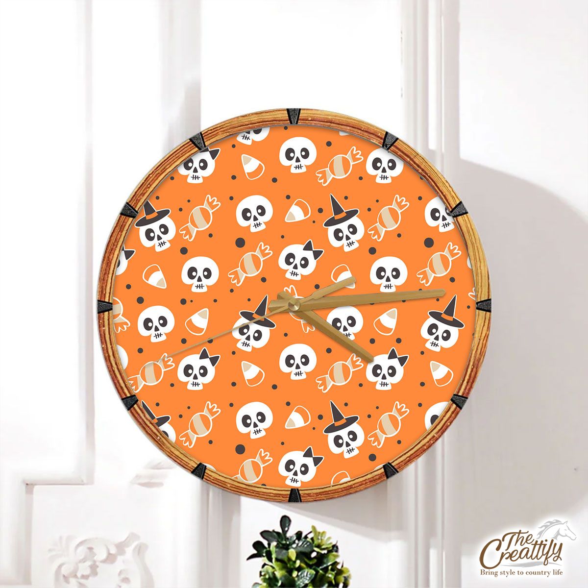 Halloween Candy Cartoon Skull With Witch Hat On Orange Color Background Wall Clock