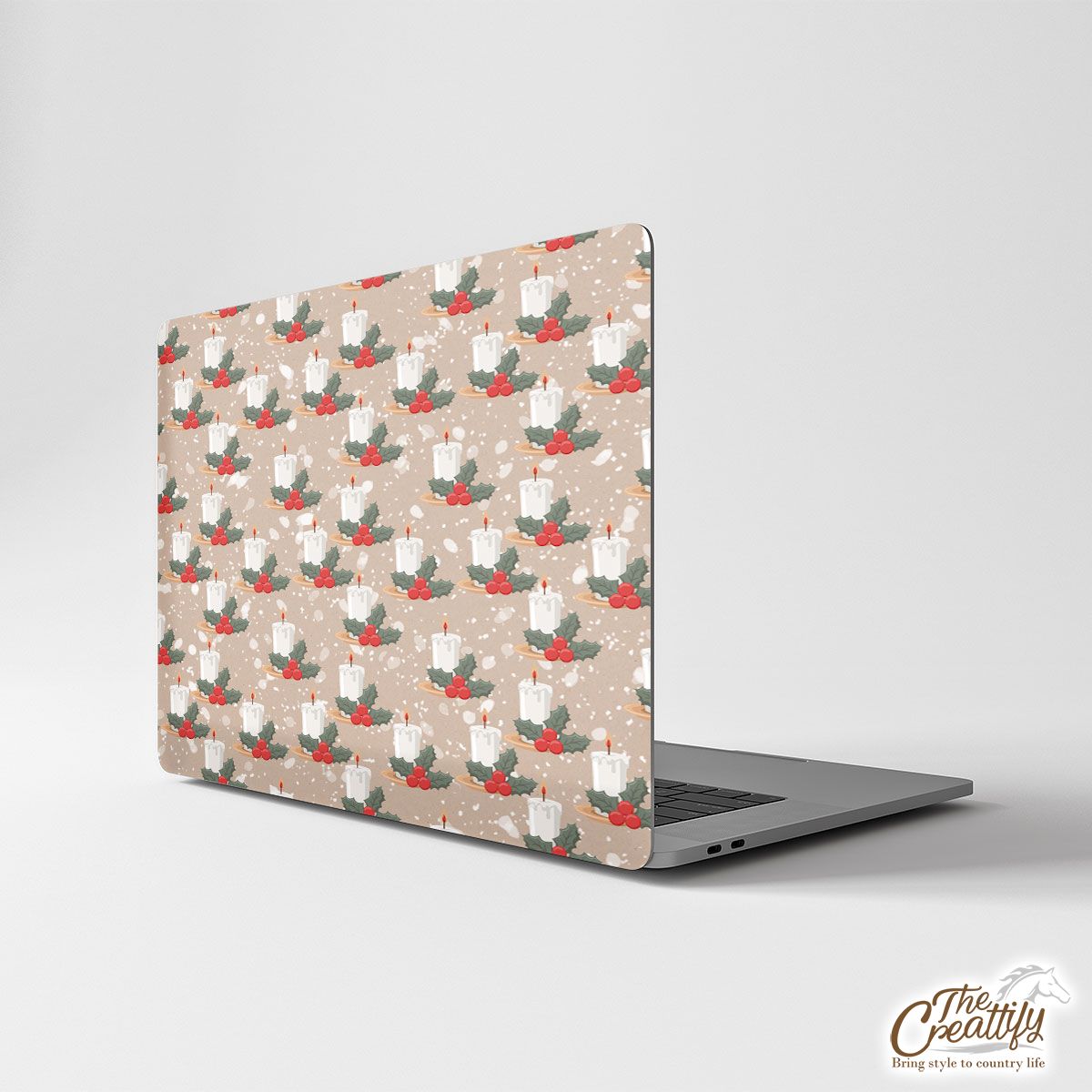 Christmas Candle With Holly Leaf On Snowflake Background Laptop Skin