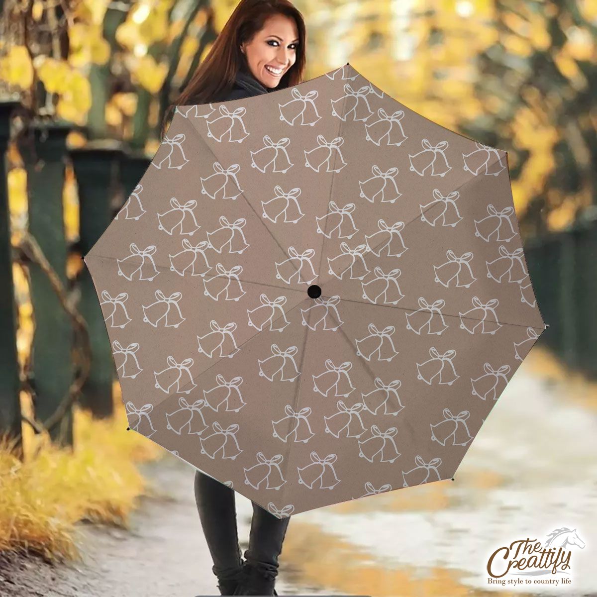 White Christmas Bell On Beige Nude Background Umbrella
