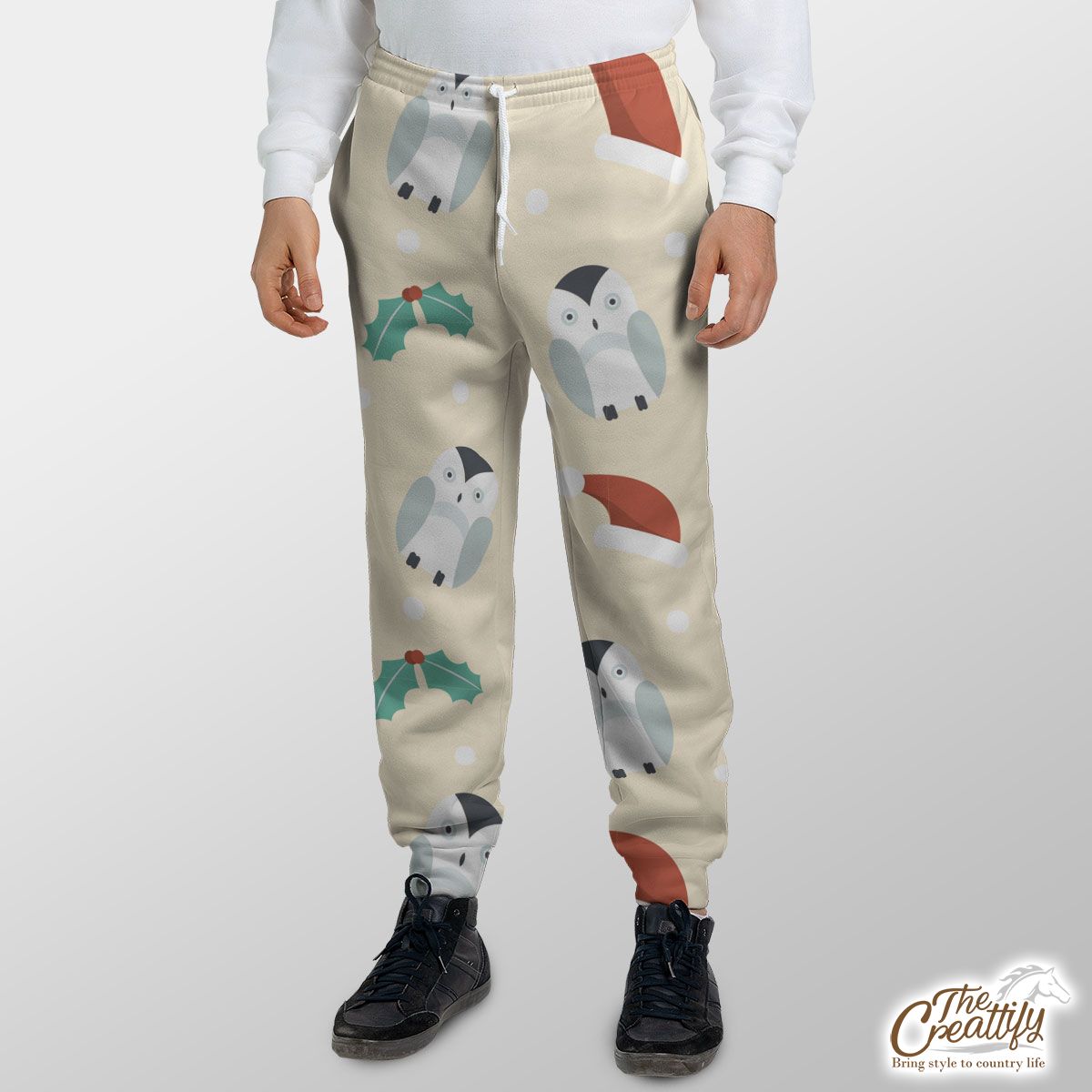 Christmas Penguins, Holly Leaf On Light Yellow Background Sweatpants