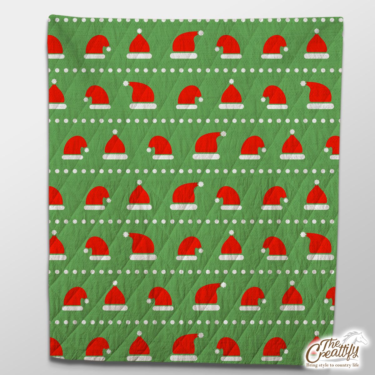 Red And White Santa Hat On Green Background Quilt