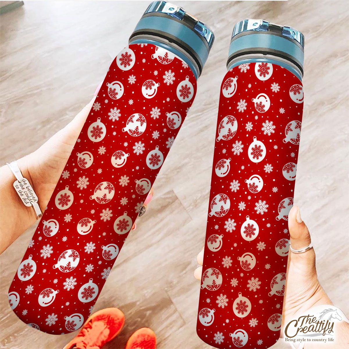 Red And White Christmas Balls On The Snowflake Background Tracker Bottle
